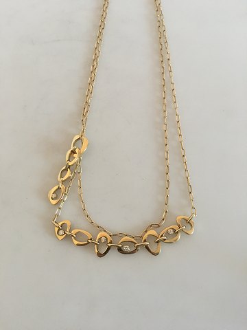 Georg Jensen Lina Falkesgaard 18K Guld Collier prydet med 10 diamanter.