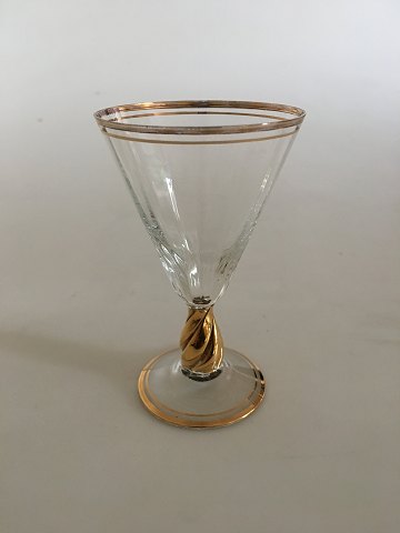 Holmegaard "Ida" hedvinsglas med guld på stilk, rand og fod.