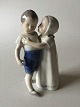 Royal Copenhagen Figurine No 406 af Pige der Krammer Dreng